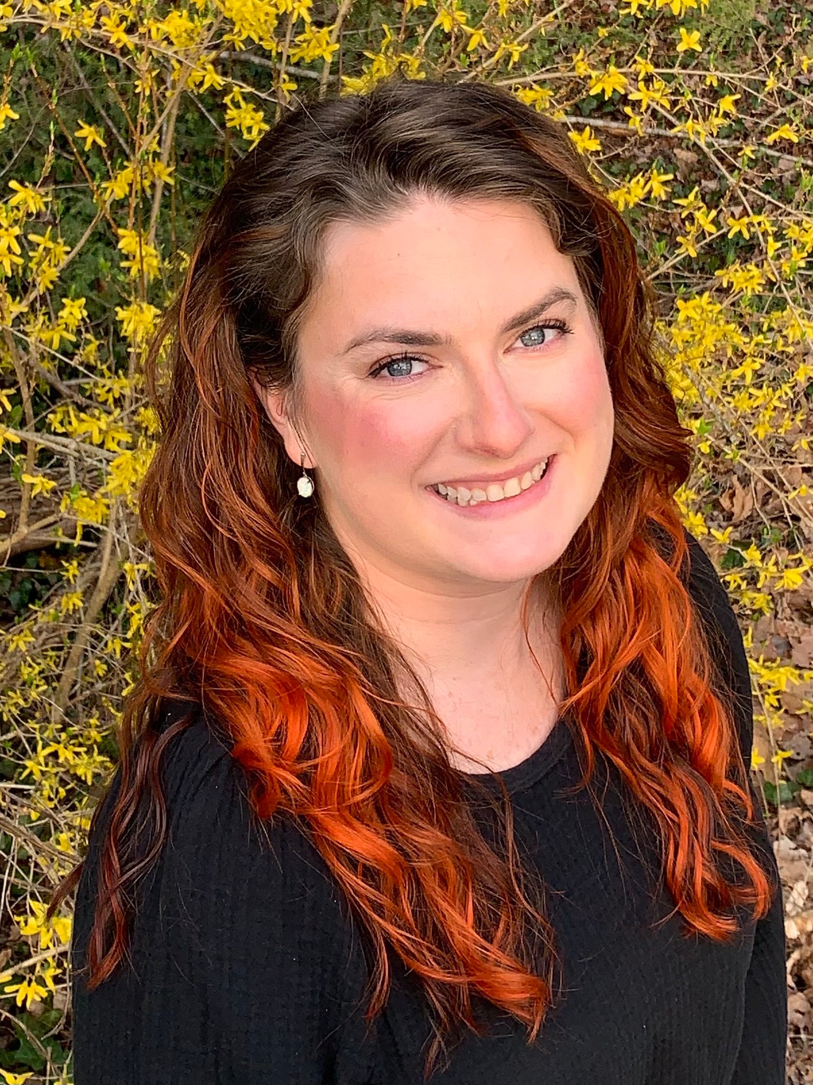 woman with white skin and curly orange hair