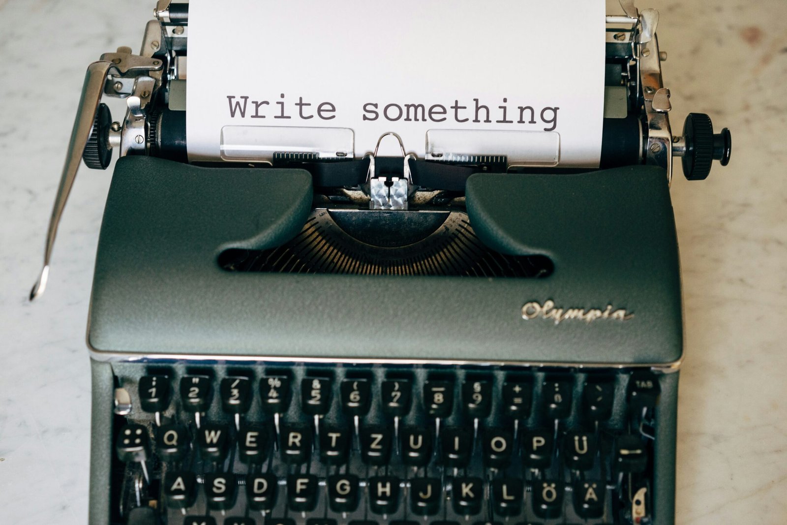typewriter with words write something